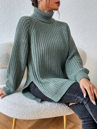 Pull col roulé vert en maille texturée, manches longues, coupe ample, fente d’ourlet