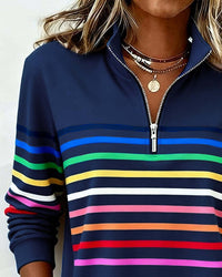 Haut sweat demi-zip bleu nuit à rayures horizontales colorées, zip contrasté au col.