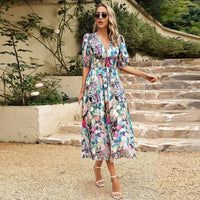 Robe midi à col en V à imprimé floral multicolore, manches bouffantes, taille froncée.