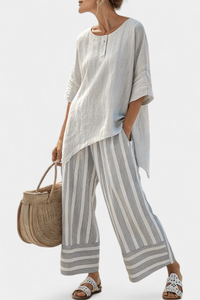 Blouse asymétrique en lin gris clair, encolure ronde et manches évasées au coude