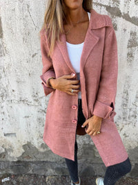 Veste blazer Stella rose à boutons, coupe longue, col châle et poignets boutonnés.