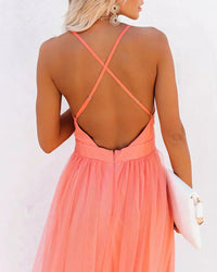 Robe longue corail clair en tulle, dos croisé en X, fermeture centrale