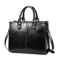 Sac cabas en cuir noir, anses rigides et bandoulière avec boucle