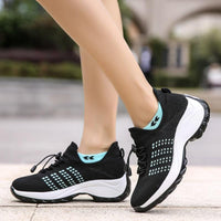 Baskets FlexiFit™ noires, tige tricot avec détails turquoise et semelle blanche
