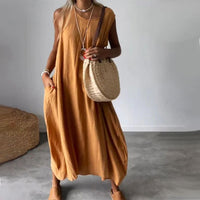 Robe midi sans manches jaune, encolure ronde et tombé ample fluide.
