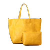 Grand sac cabas rétro jaune avec anses et pochette zippée assortie.