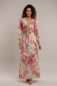 Robe d’été longue à manches bouffantes, décolleté V et nœud, imprimé floral pastel.