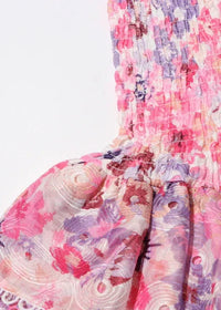 Jupe courte évasée rose fleurie : volants froissés et smocks