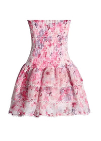 Robe fleurie bustier rose à volant festonné, jupe courte en tulle imprimé